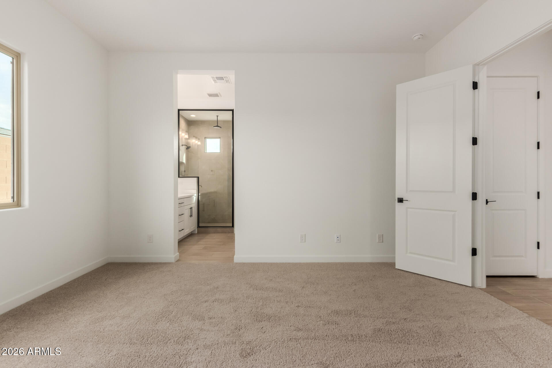 15890 West Miami Street Goodyear, AZ 85338 - Photo 12 of 51 a view of an empty room with a window