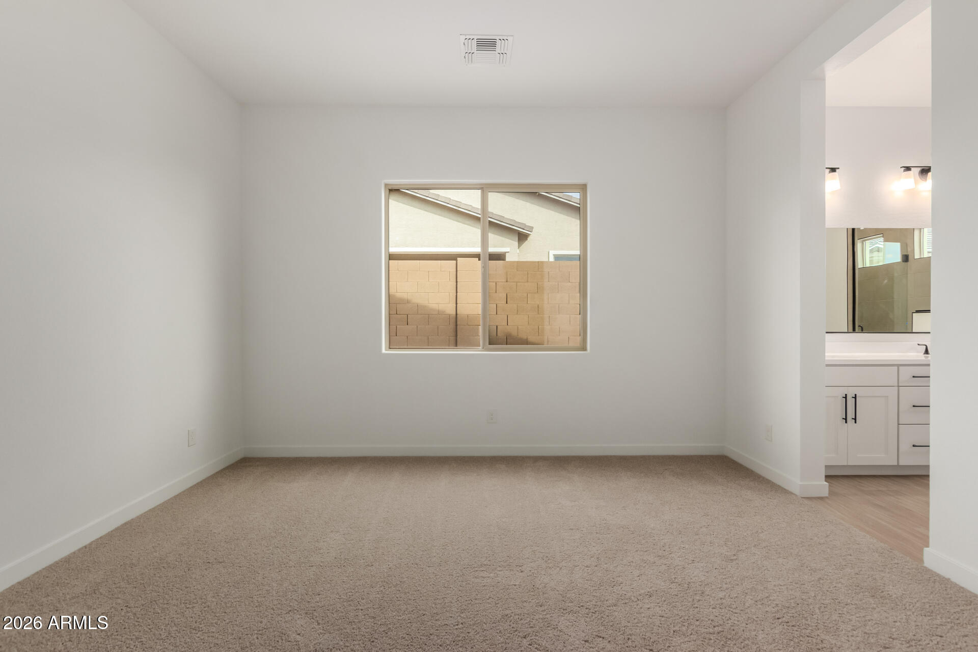 15890 West Miami Street Goodyear, AZ 85338 - Photo 13 of 51 an empty room with a window