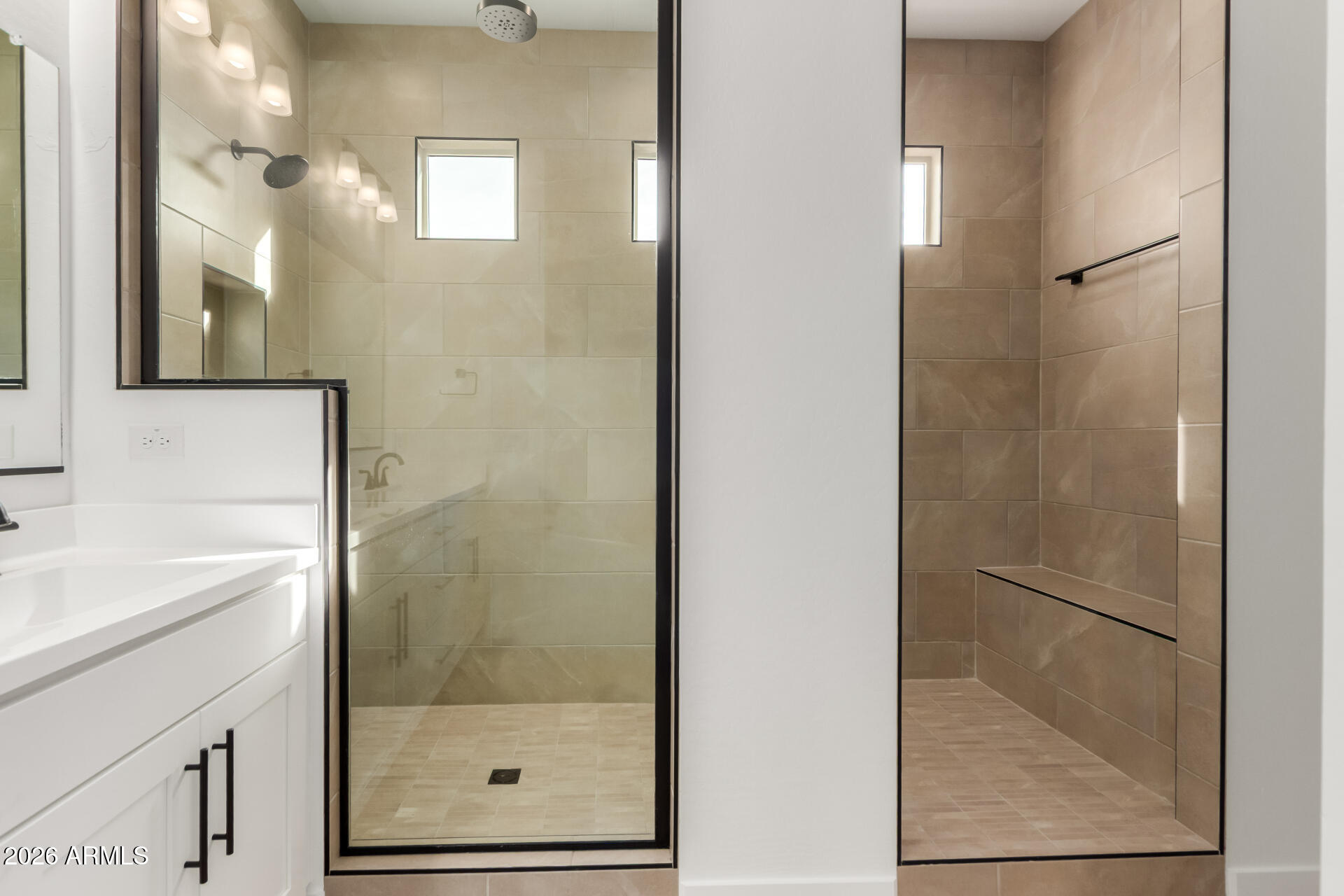 15890 West Miami Street Goodyear, AZ 85338 - Photo 16 of 51 a bathroom with a shower a mirror and a sink