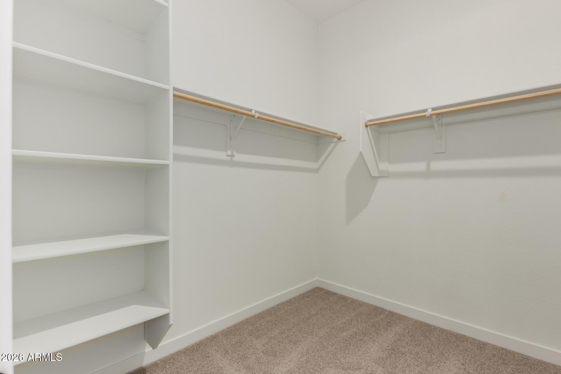 15890 West Miami Street Goodyear, AZ 85338 - Photo 18 of 51 a view of an empty walk in closet