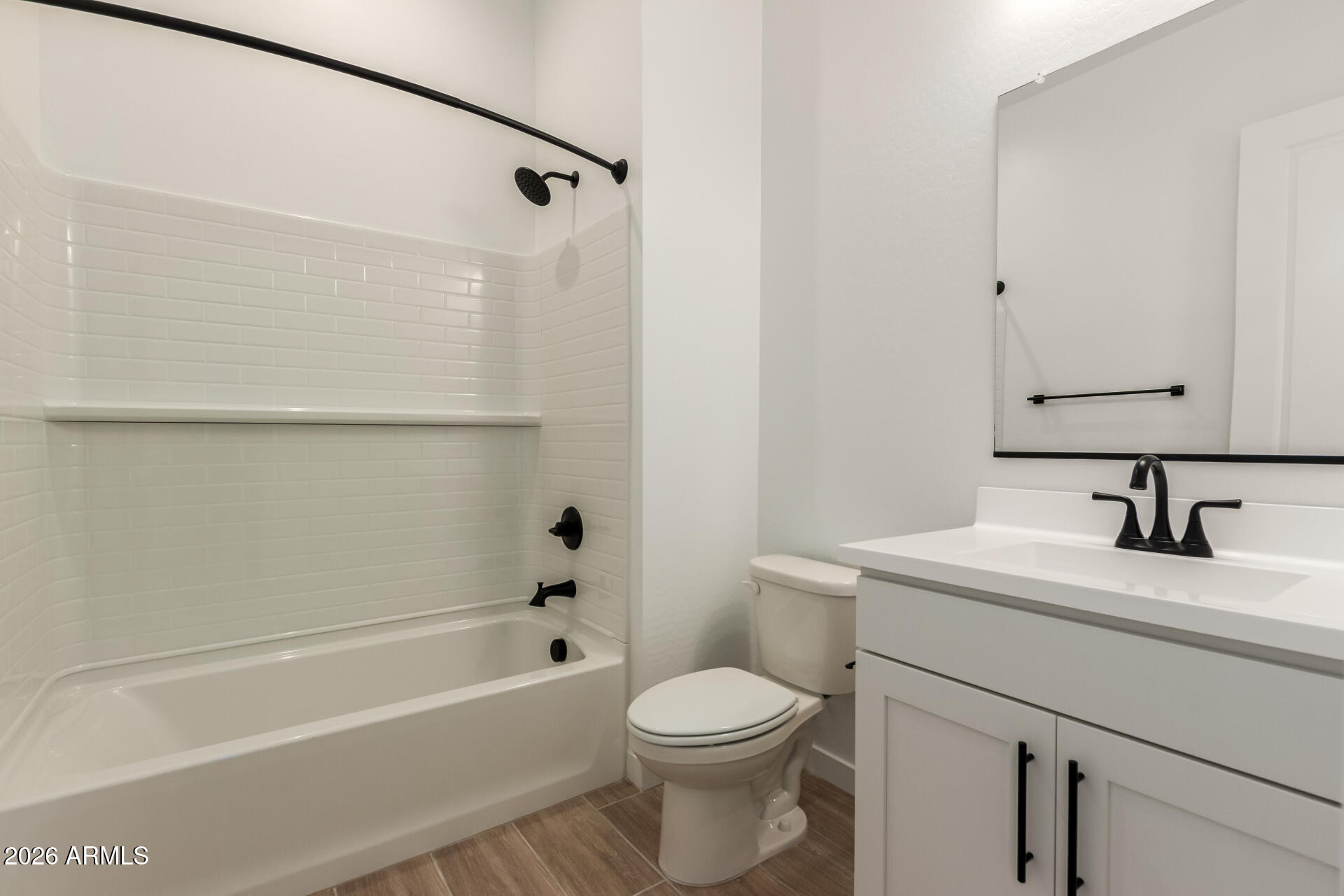 15890 West Miami Street Goodyear, AZ 85338 - Photo 22 of 51 a bathroom with a sink a toilet and a bathtub