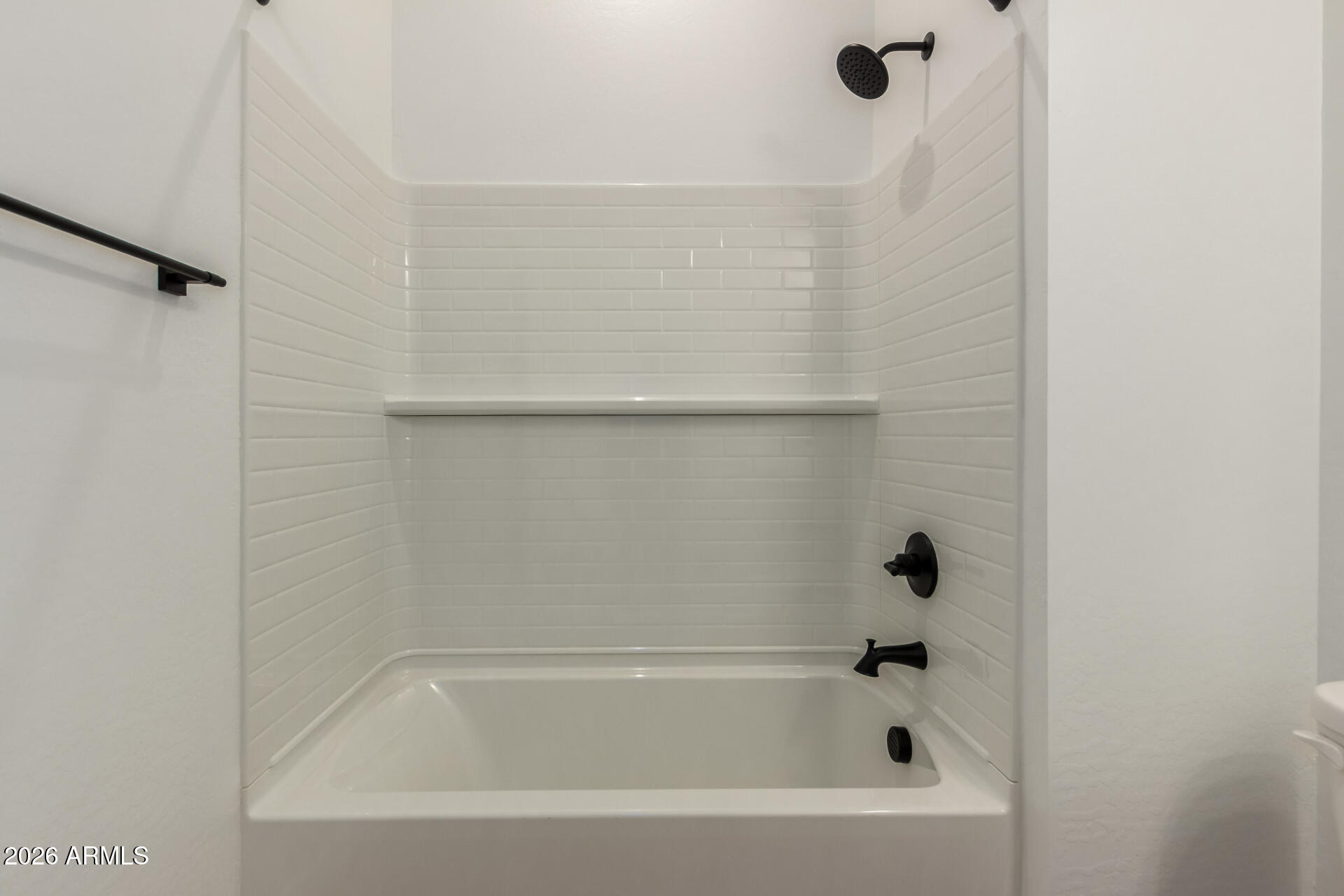 15890 West Miami Street Goodyear, AZ 85338 - Photo 23 of 51 a bathroom with a bathtub