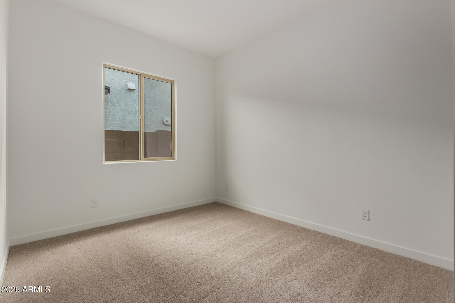 15890 West Miami Street Goodyear, AZ 85338 - Photo 24 of 51 an empty room with a window