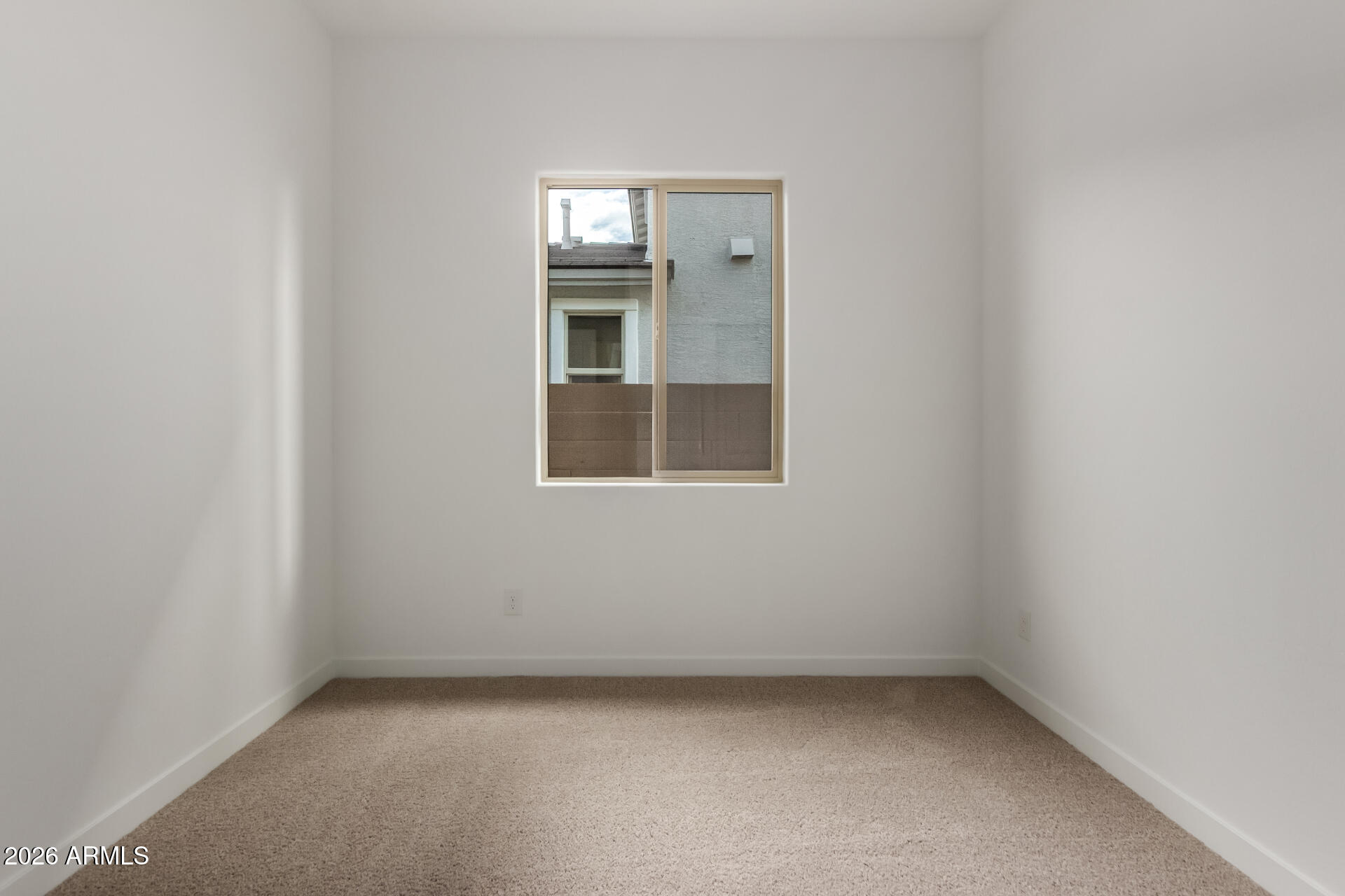 15890 West Miami Street Goodyear, AZ 85338 - Photo 26 of 51 an empty room with a window