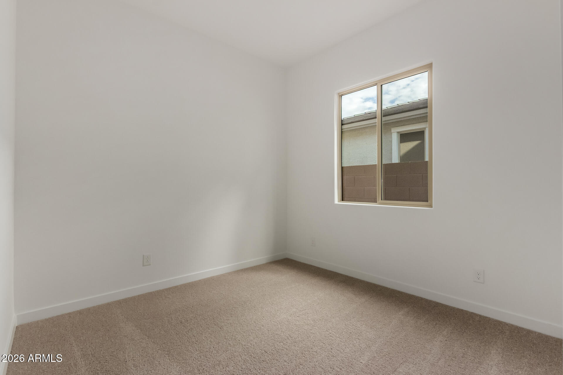 15890 West Miami Street Goodyear, AZ 85338 - Photo 27 of 51 a view of an empty room with a window