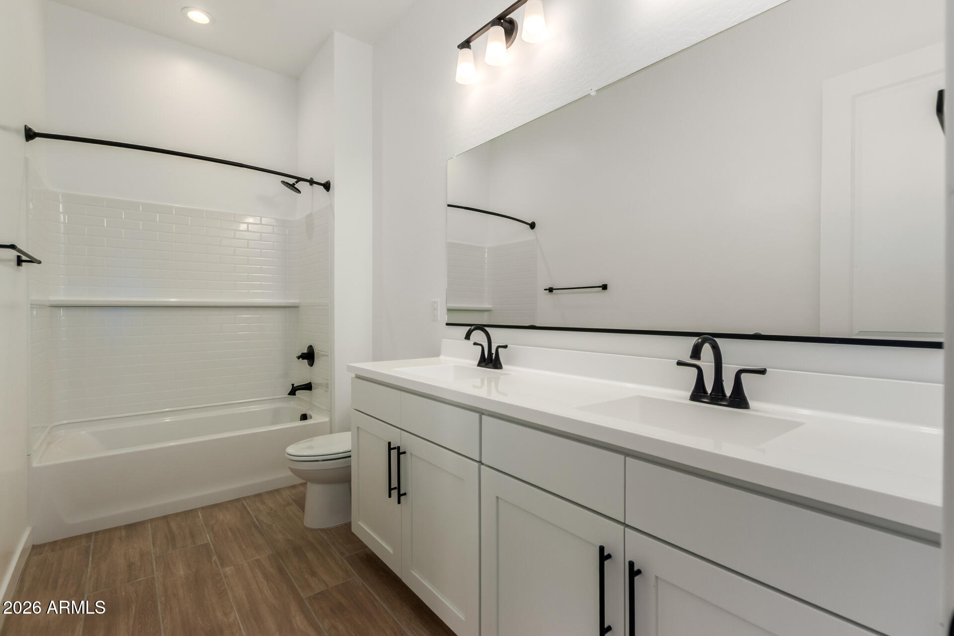 15890 West Miami Street Goodyear, AZ 85338 - Photo 33 of 51 a bathroom with a sink a toilet and shower
