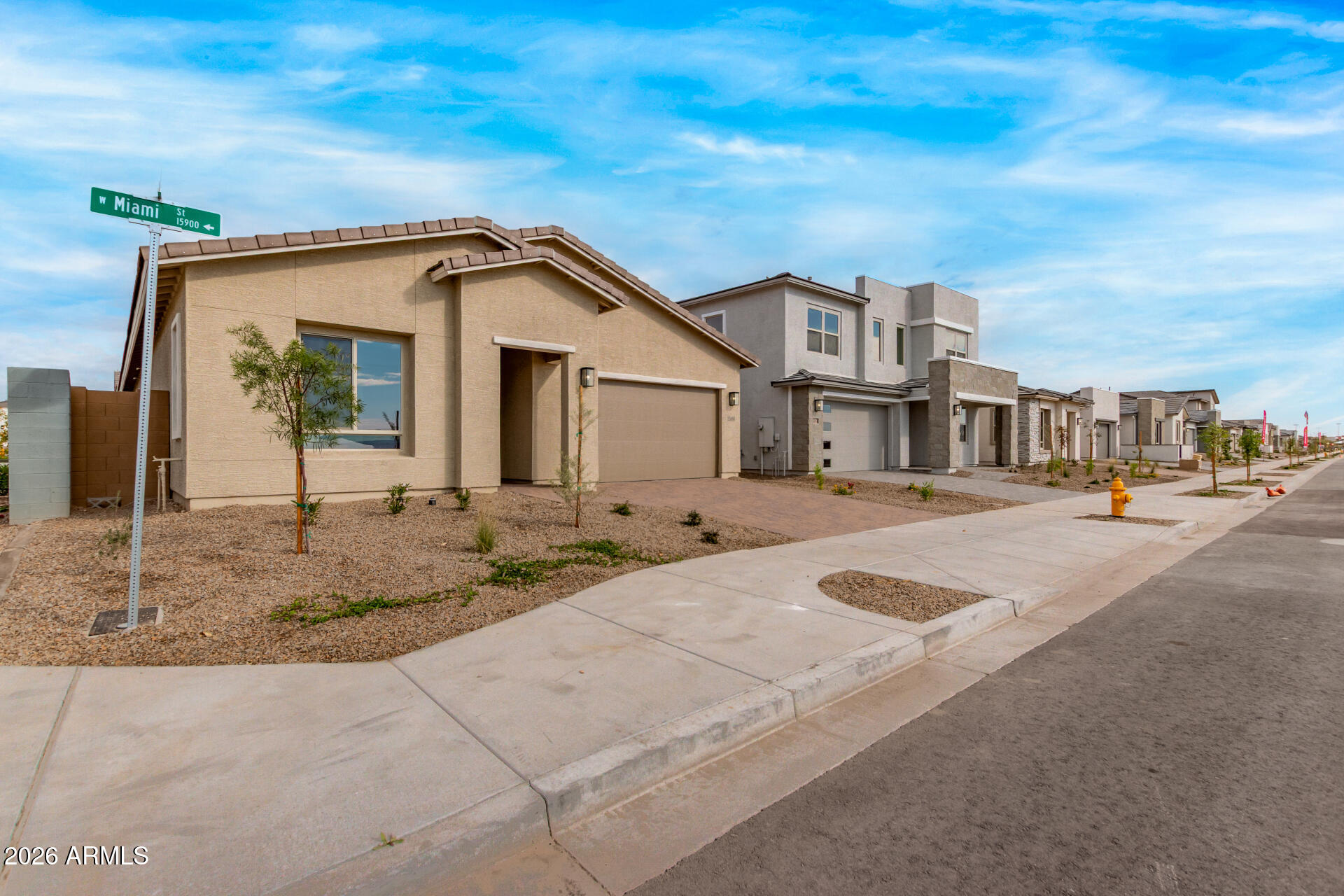 15890 West Miami Street Goodyear, AZ 85338 - Photo 42 of 51 a view of a white house with a small yard