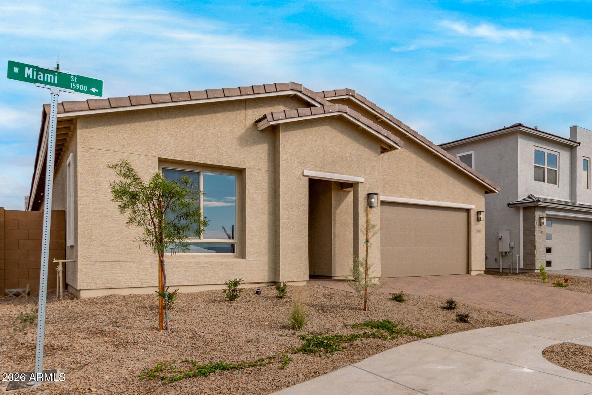 15890 West Miami Street Goodyear, AZ 85338 - Photo 46 of 51 a front view of a house with garden