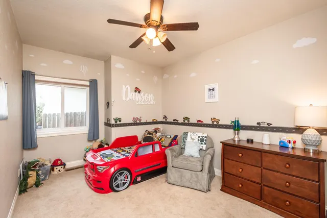 a bedroom with furniture and a window