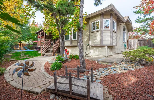 a front view of a house with garden