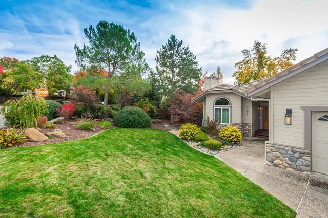 a front view of a house with garden