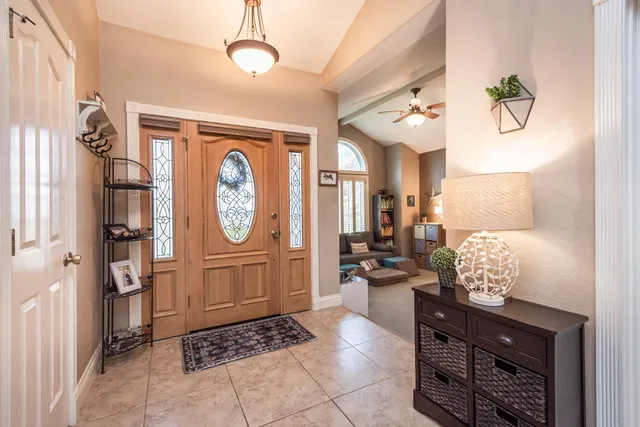 a living room with granite countertop furniture and a clock