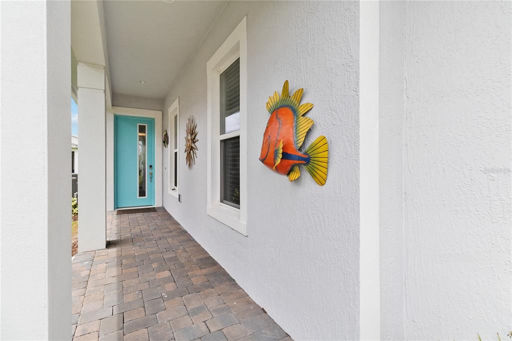 2557 Yellow Brick Road St. Cloud, FL 34772 - Photo 4 of 41 a view of a hallway with wooden floor