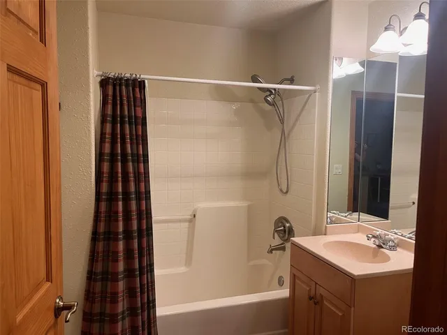 a bathroom with a bathtub and a sink