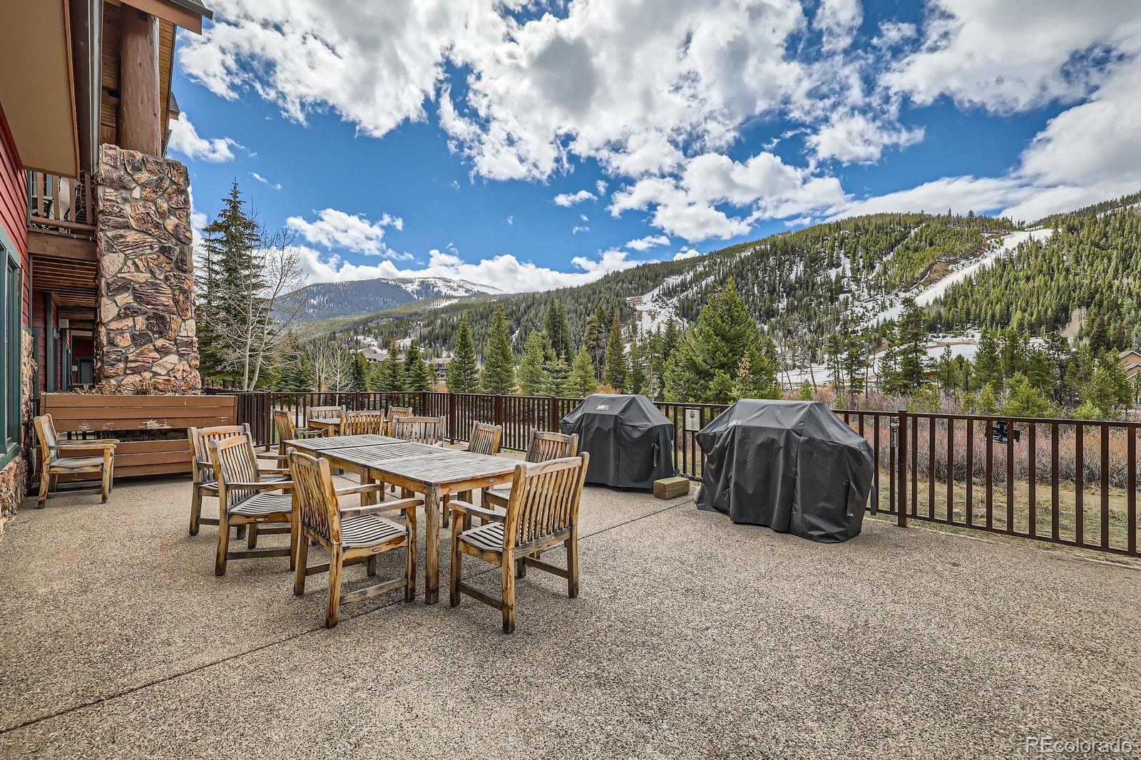 22714 Highway 6, Unit 5945 Keystone, CO 80435 - Photo 23 of 37 a view of a patio with a table and chairs