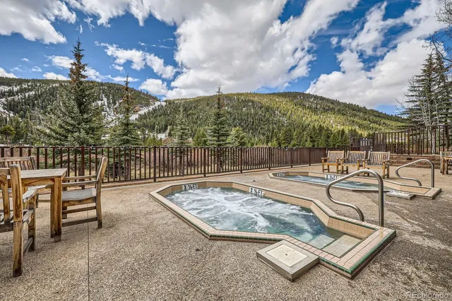 a view of a patio with swimming pool