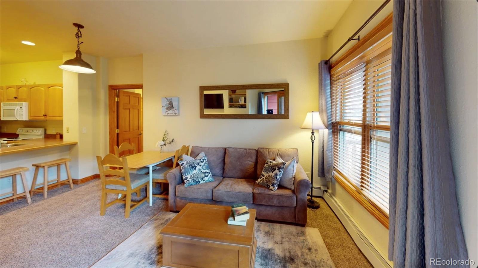 22714 Highway 6, Unit 5945 Keystone, CO 80435 - Photo 3 of 37 a living room with furniture and a large window