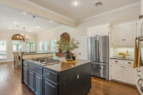 a bedroom with a bed and a dresser in it