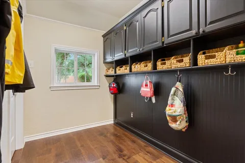 a front view of a house with yard and green space