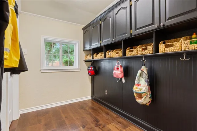 a front view of a house with yard and green space