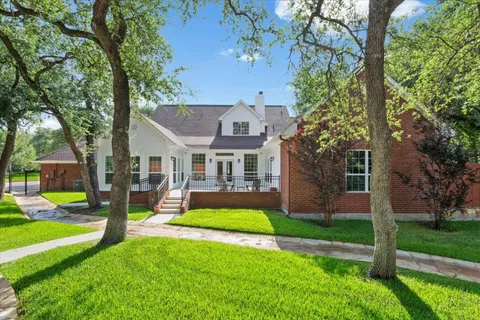 a view of swimming pool with outdoor seating and yard