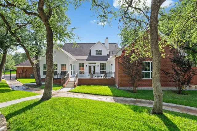 a view of swimming pool with outdoor seating and yard