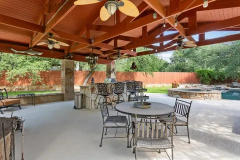 a kitchen with stainless steel appliances granite countertop a sink and stove