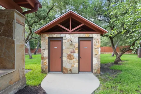 a view of a park with large trees