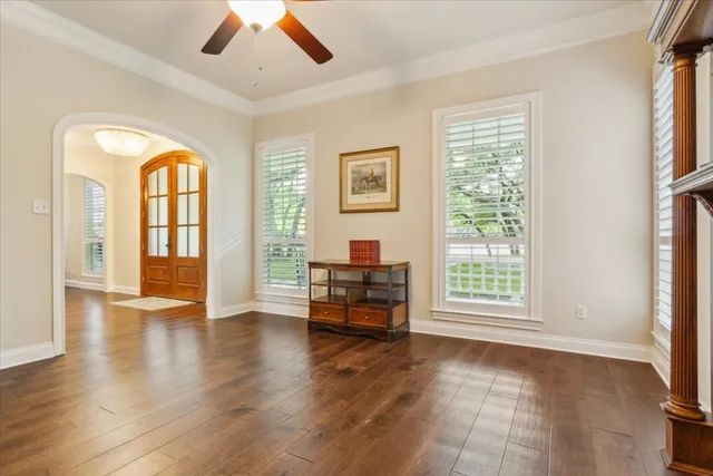 a view of a dining room with furniture window and wooden floor