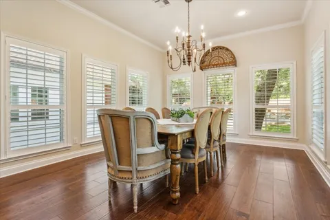 a kitchen with kitchen island granite countertop a sink stove and cabinets