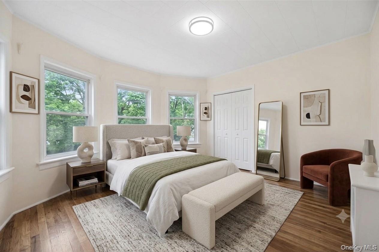 91 Parkway Road, Unit G1 Bronxville, NY 10708 - Photo 12 of 28 a bedroom with a bed and wooden floor