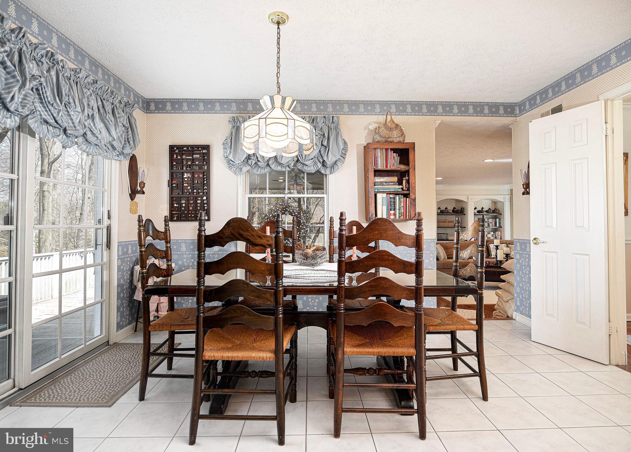 627 Northgate Road Aberdeen, MD 21001 - Photo 11 of 43 a view of a dining room with furniture and chandelier