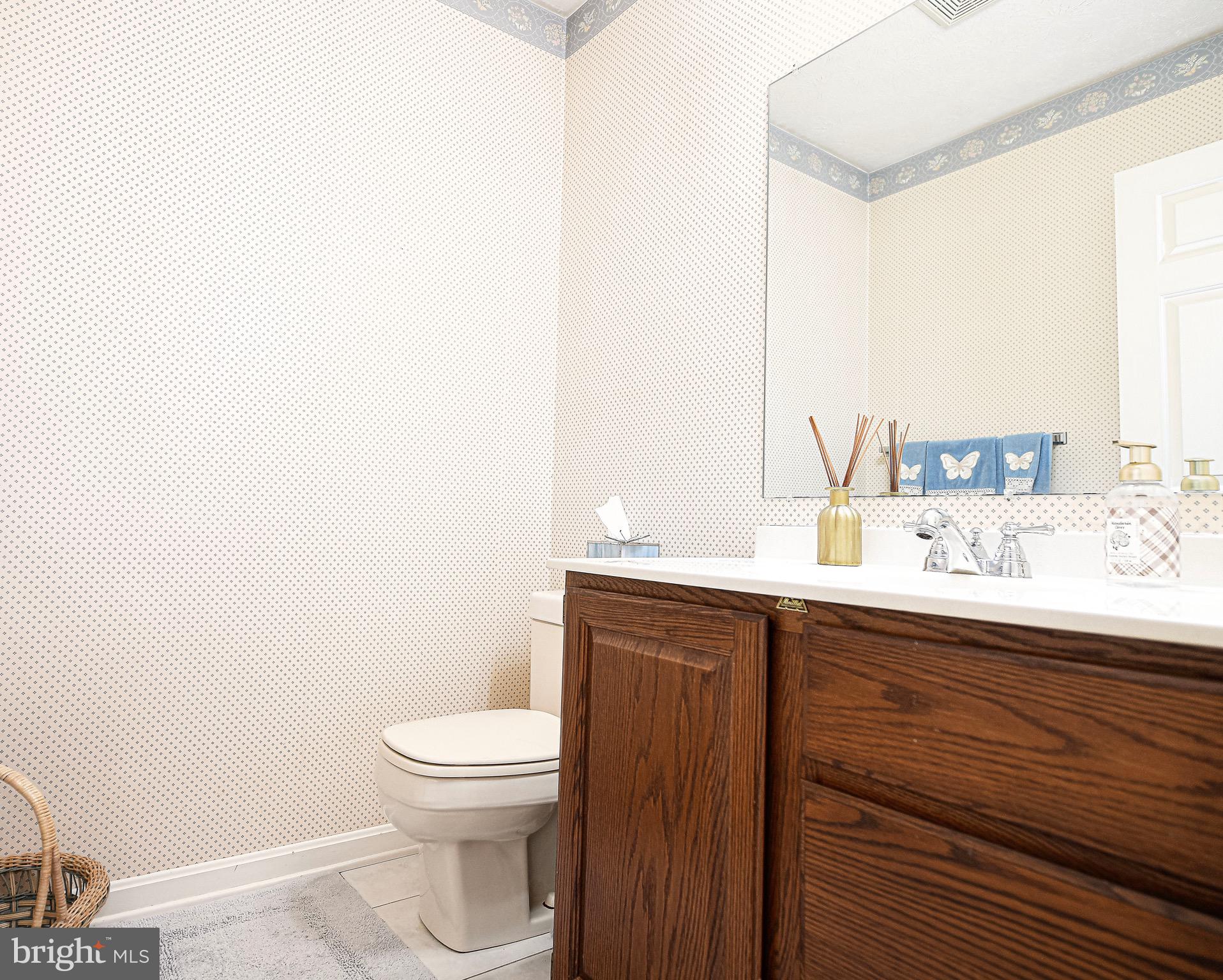 627 Northgate Road Aberdeen, MD 21001 - Photo 15 of 43 a bathroom with a sink a toilet and mirror