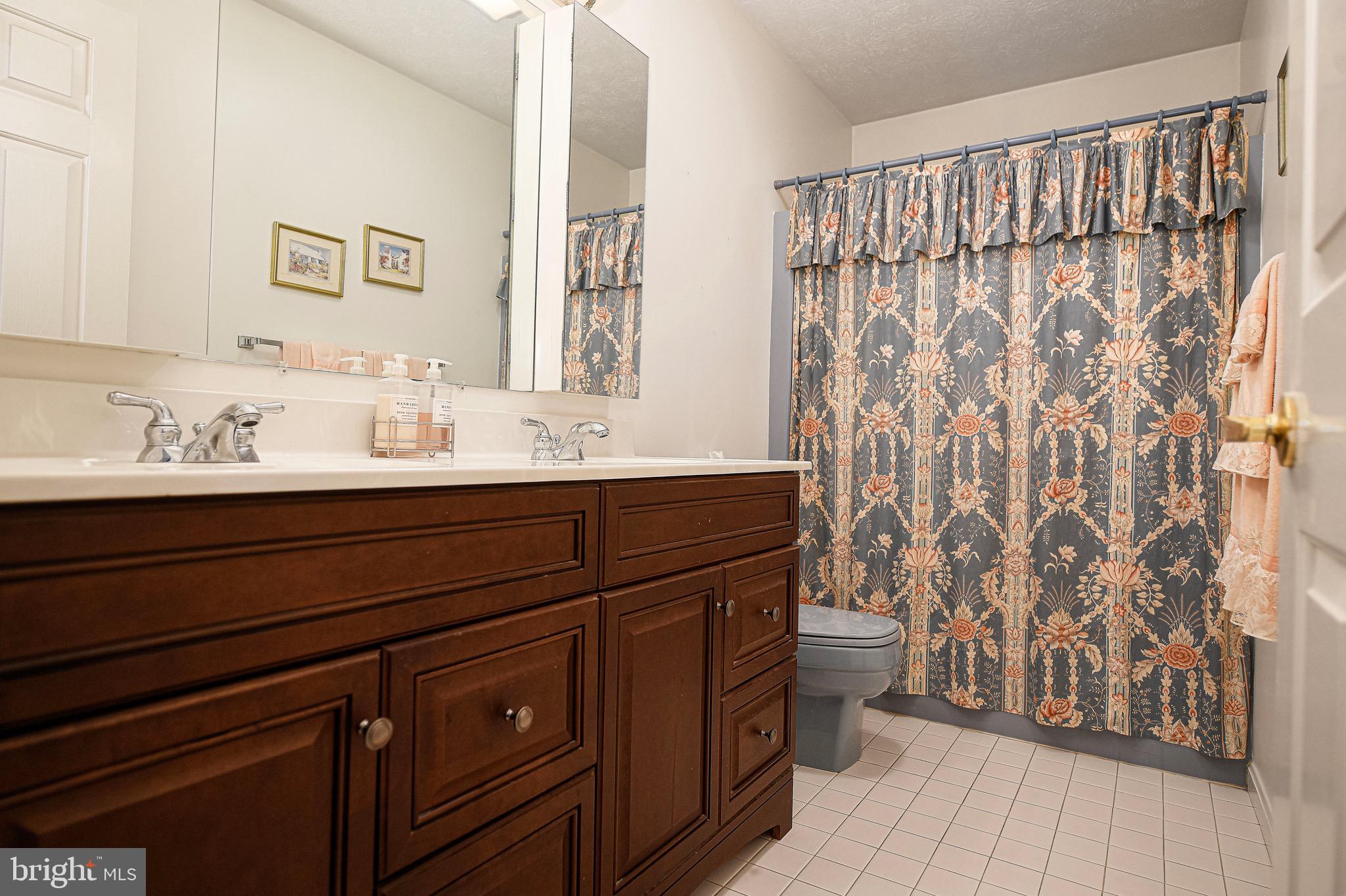 627 Northgate Road Aberdeen, MD 21001 - Photo 30 of 43 a bathroom with a sink and a mirror