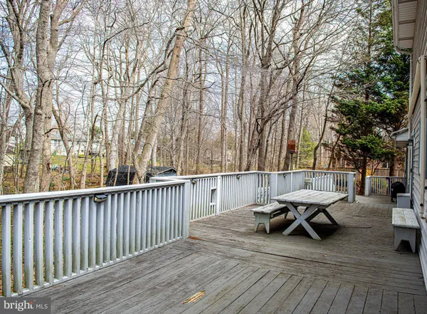a view of roof deck with patio