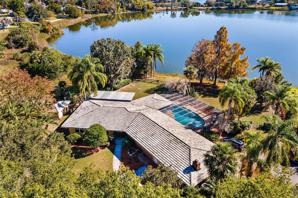 an aerial view of a house with a ocean view