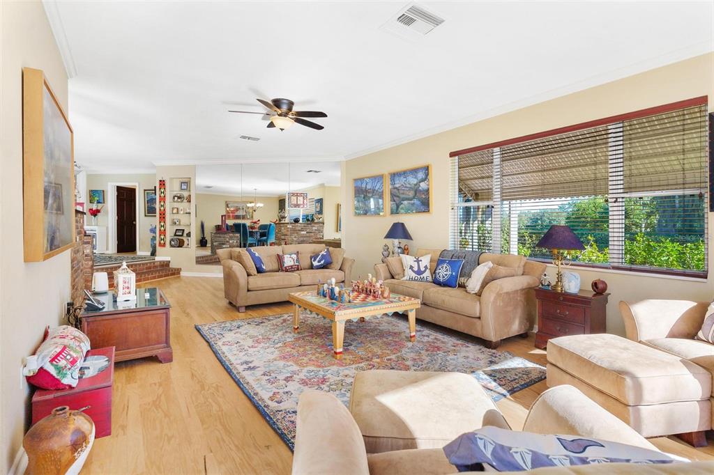 475 Guerrant Street Umatilla, FL 32784 - Photo 11 of 63 a living room with furniture and a large window