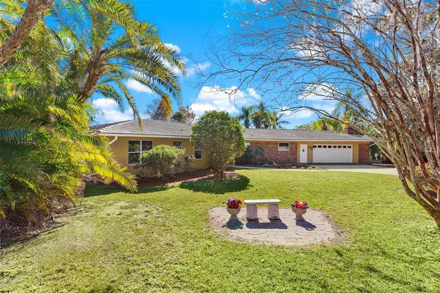 a living room with furniture wooden floor and a large window