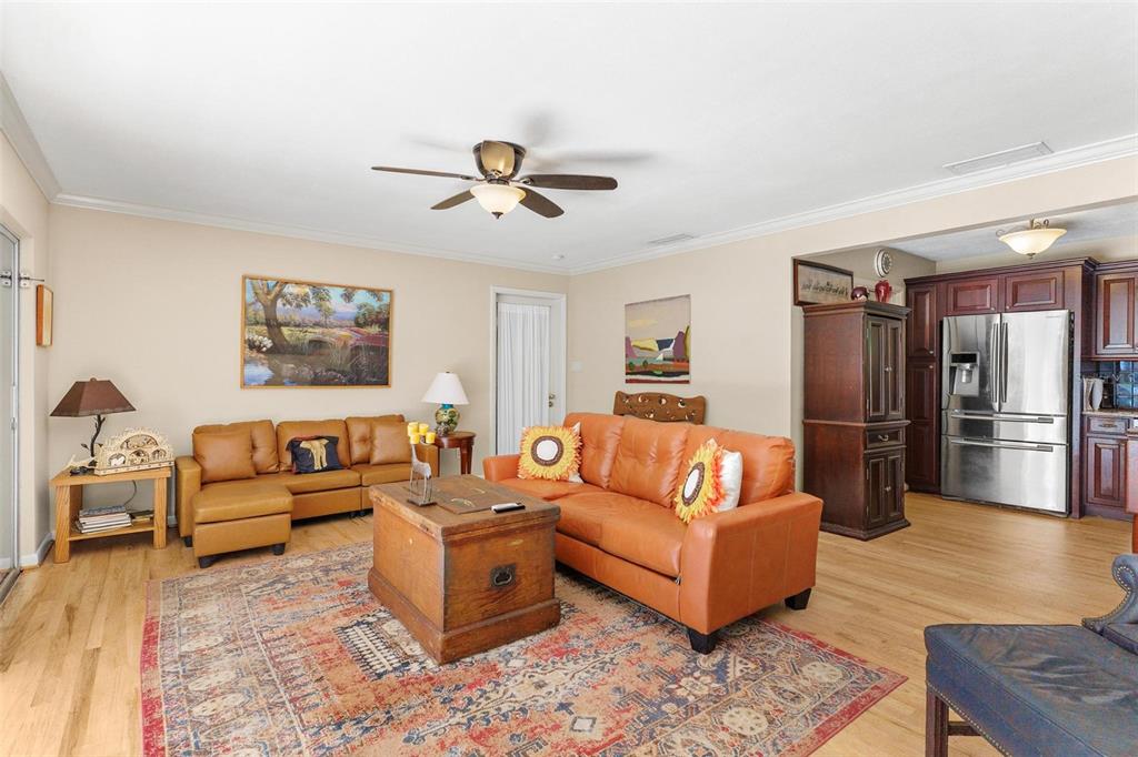 475 Guerrant Street Umatilla, FL 32784 - Photo 23 of 63 a living room with furniture and a wooden floor