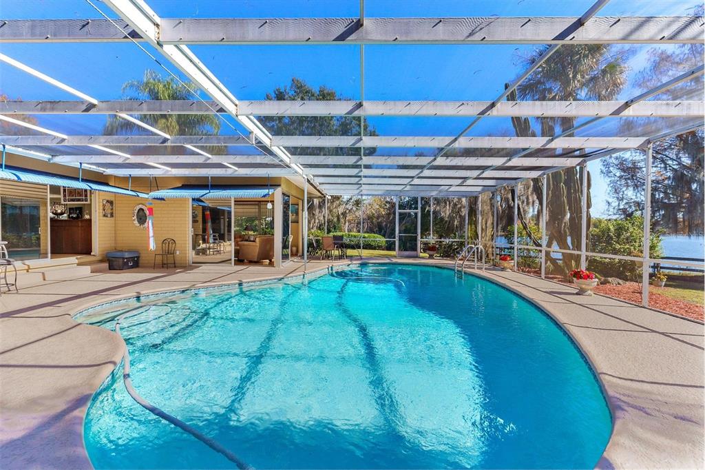 475 Guerrant Street Umatilla, FL 32784 - Photo 3 of 63 a view of a swimming pool with a patio