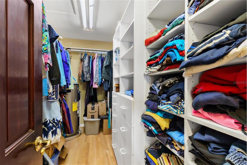475 Guerrant Street Umatilla, FL 32784 - Photo 31 of 63 a view of walk in closet with clothes and shoes