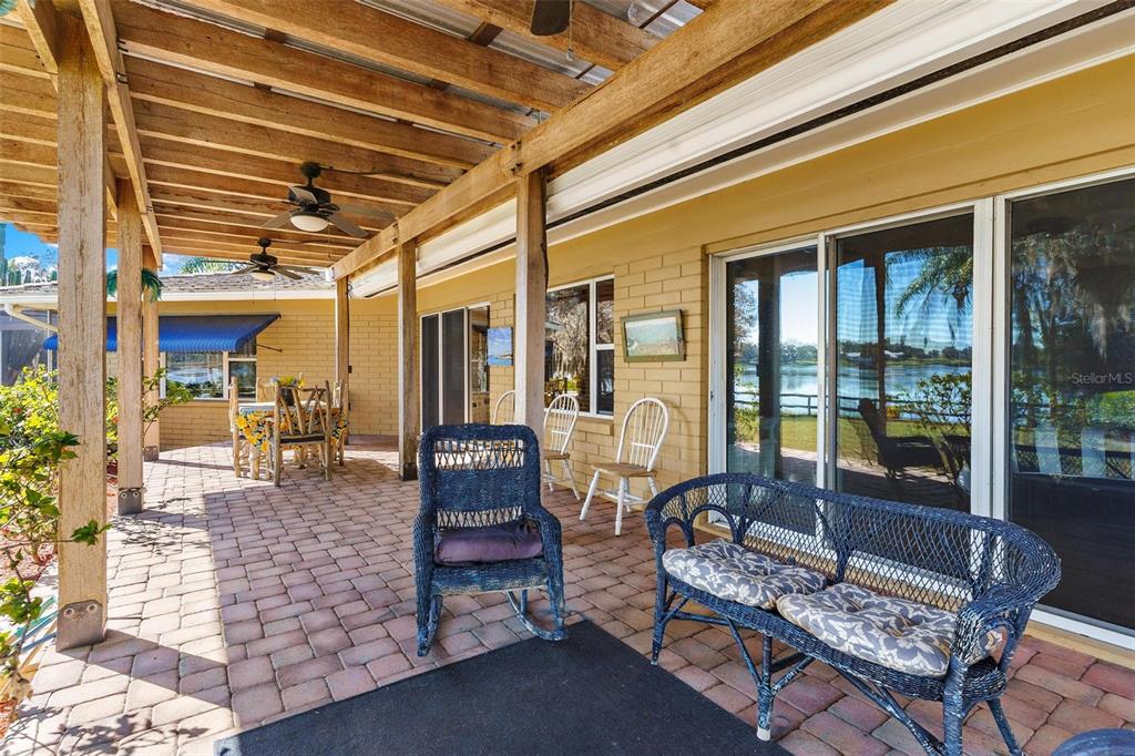 475 Guerrant Street Umatilla, FL 32784 - Photo 50 of 63 a outdoor living space with patio furniture and a potted plant