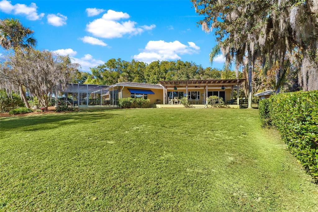 475 Guerrant Street Umatilla, FL 32784 - Photo 51 of 63 a view of a house with a big yard