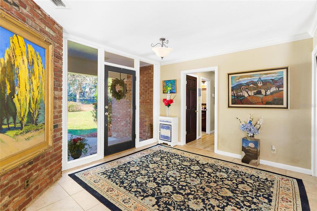 475 Guerrant Street Umatilla, FL 32784 - Photo 6 of 63 a view of a hallway with wooden floor and windows