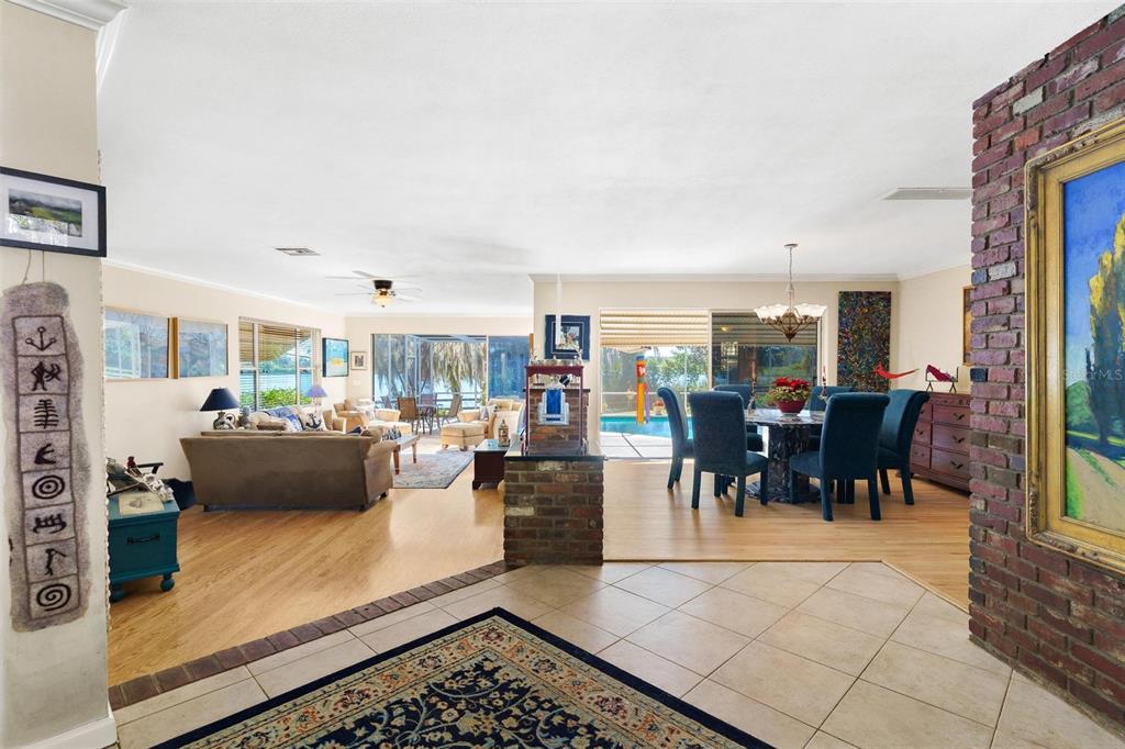 475 Guerrant Street Umatilla, FL 32784 - Photo 7 of 63 a living room with lots of furniture and a view of kitchen