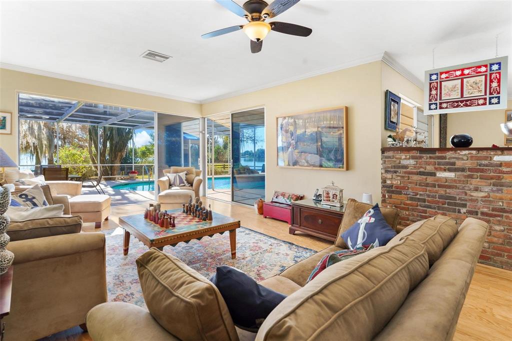 475 Guerrant Street Umatilla, FL 32784 - Photo 8 of 63 a living room with furniture and a large window