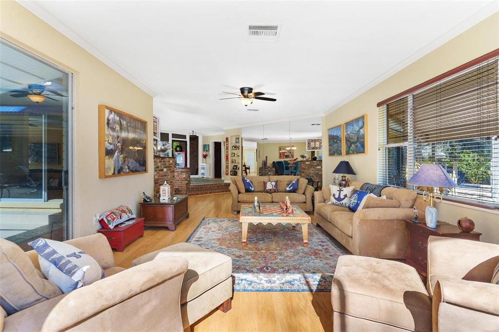 475 Guerrant Street Umatilla, FL 32784 - Photo 10 of 63 a living room with furniture and a large window