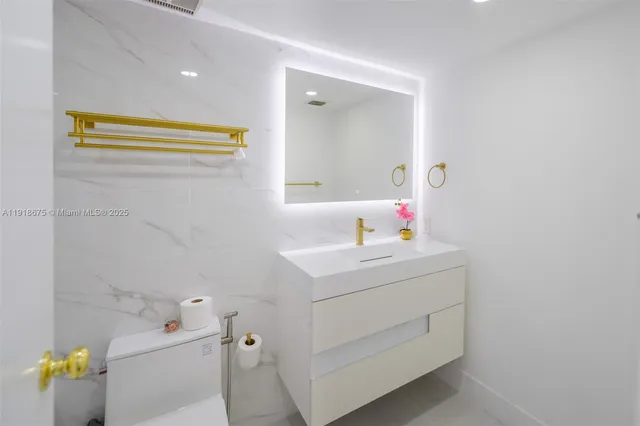 a bathroom with a sink vanity and a mirror