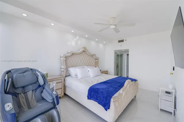 a bedroom with a bed and a chair