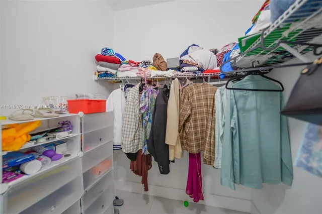 a view of a closet with storage